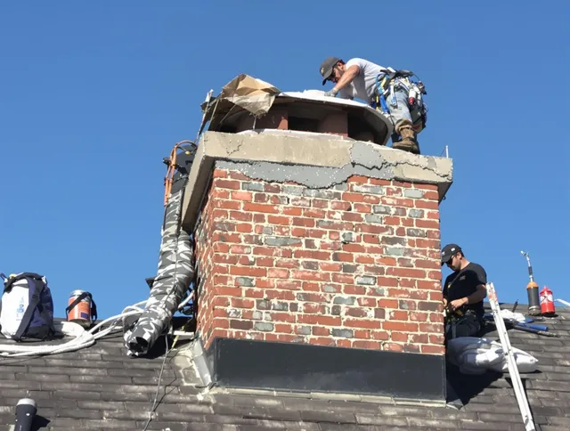 Westerville Chimney Sweep installing a custom chimney crown in Westerville, OH