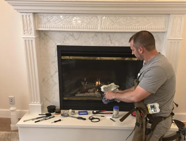 Westerville Chimney Sweep performing fireplace maintenance in Westerville, OH