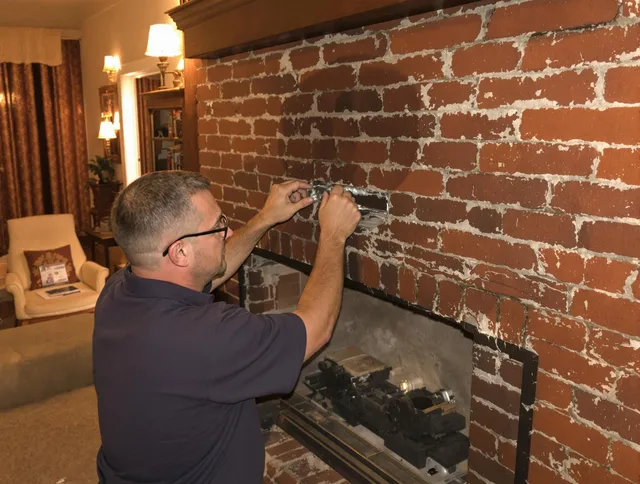 Westerville Chimney Sweep expert fixing a fireplace in Westerville, OH